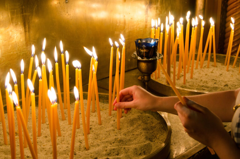 igniting candles in an orthodox church